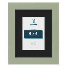 Green 9 x 7 inch picture frame with a black mount for a 6 x 4 inch photo
