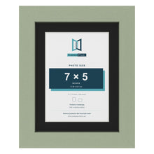 Green 9 x 7 inch picture frame with a black mount for a 7 x 5 inch photo