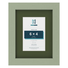 Green 9 x 7 inch picture frame with a green mount for a 6 x 4 inch photo