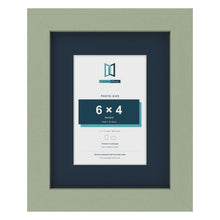 Green 9 x 7 inch picture frame with a Pacific Blue mount for a 6 x 4 inch photo