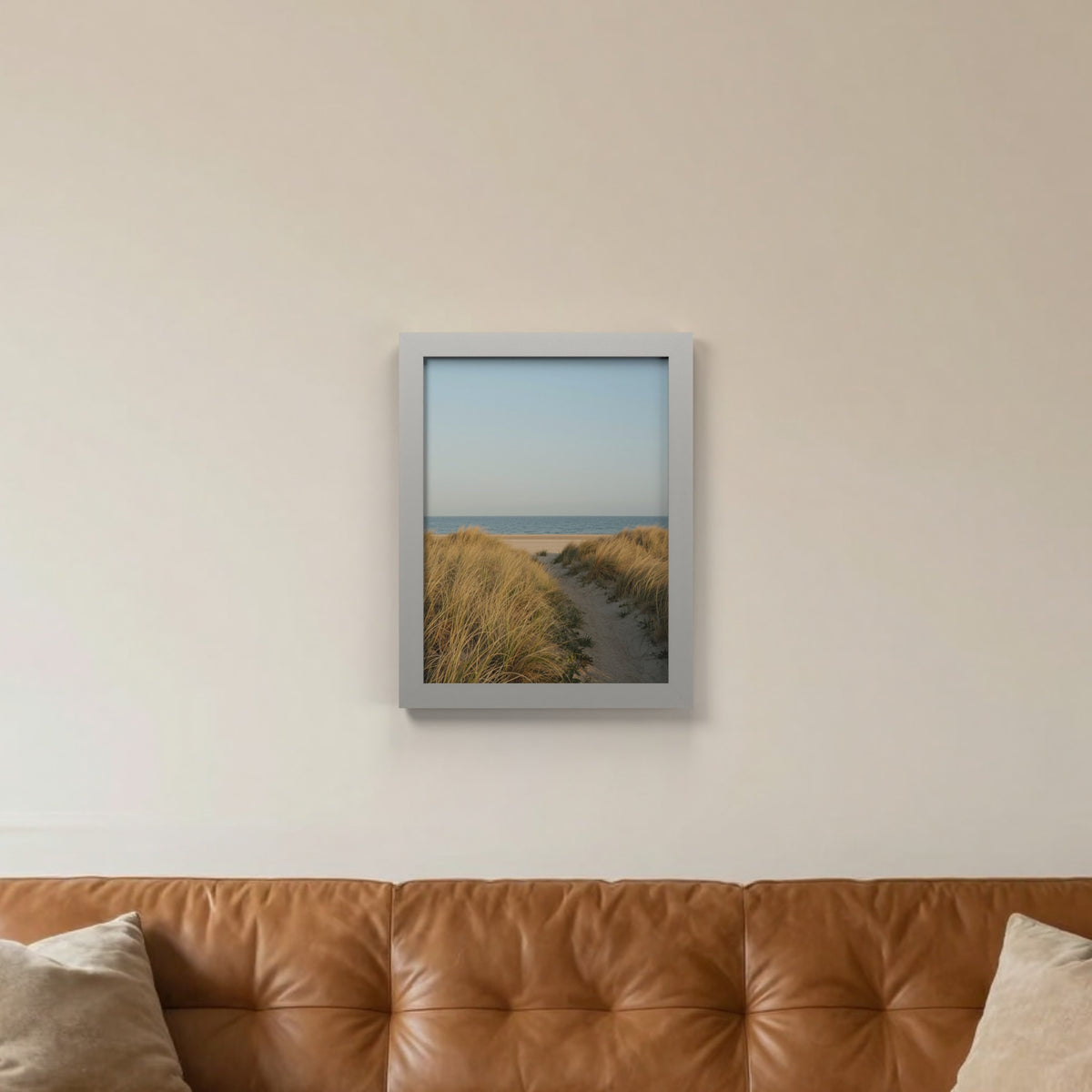 Light Grey picture frame hanging on a living room wall