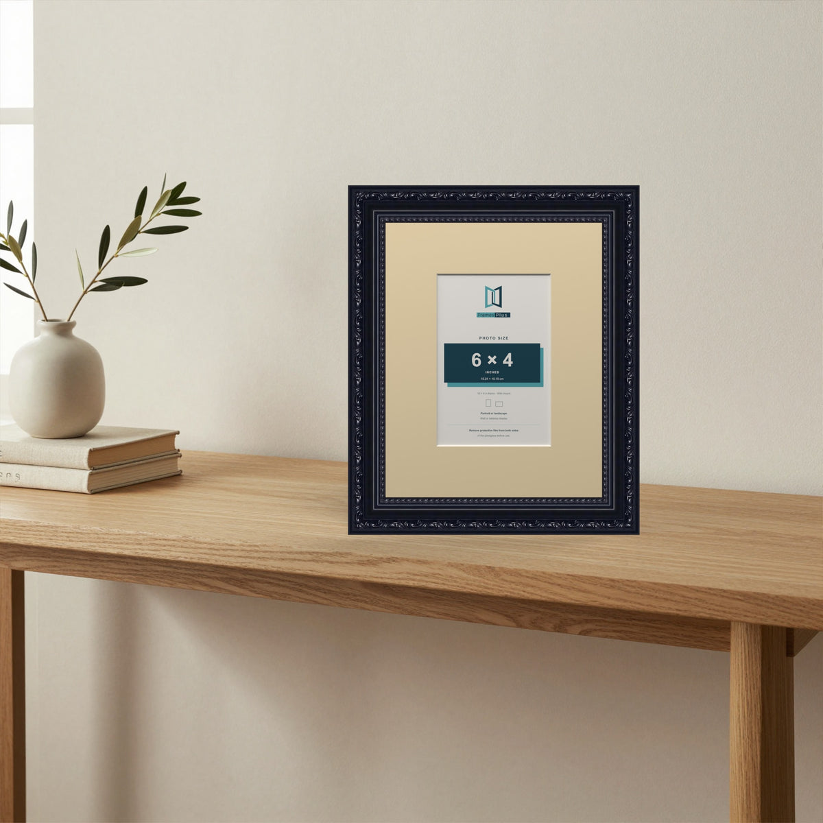 Louis Black picture frame with an ivory mount standing on a table