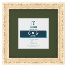 Louis Cream 10 x 10 inch picture frame with a green mount for a 6 x 6 inch photo