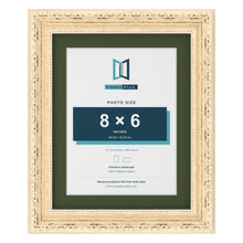 Louis Cream 10 x 8 inch picture frame with a green mount for an 8 x 6 inch photo