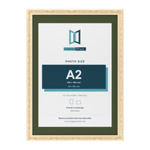 Louis Cream 70 x 50 cm picture frame with a green mount for an A2 photo