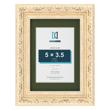 Louis Cream 7 x 5 inch picture frame with a green mount for a 5 x 3.5 inch photo