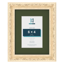Louis Cream 9 x 7 inch picture frame with a green mount for a 6 x 4 inch photo