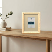 Louis Cream picture frame with an ivory mount standing on a table