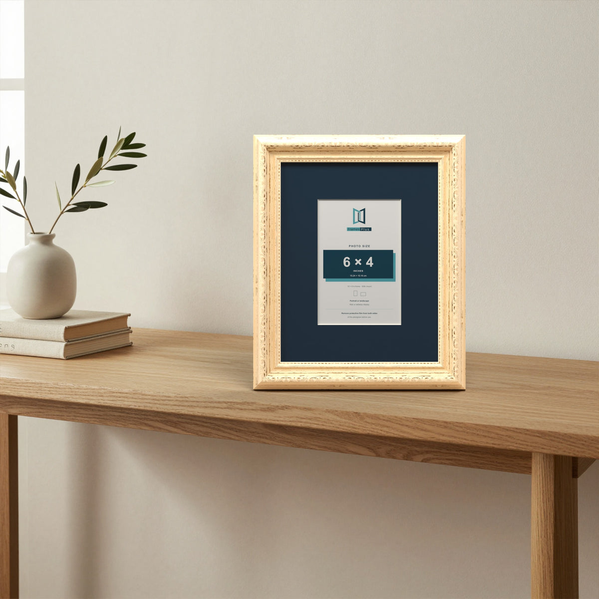 Louis Cream picture frame with a Pacific Blue mount standing on a table
