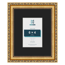 Louis Gold 10 x 8 inch picture frame with a black mount for a 6 x 4 inch photo