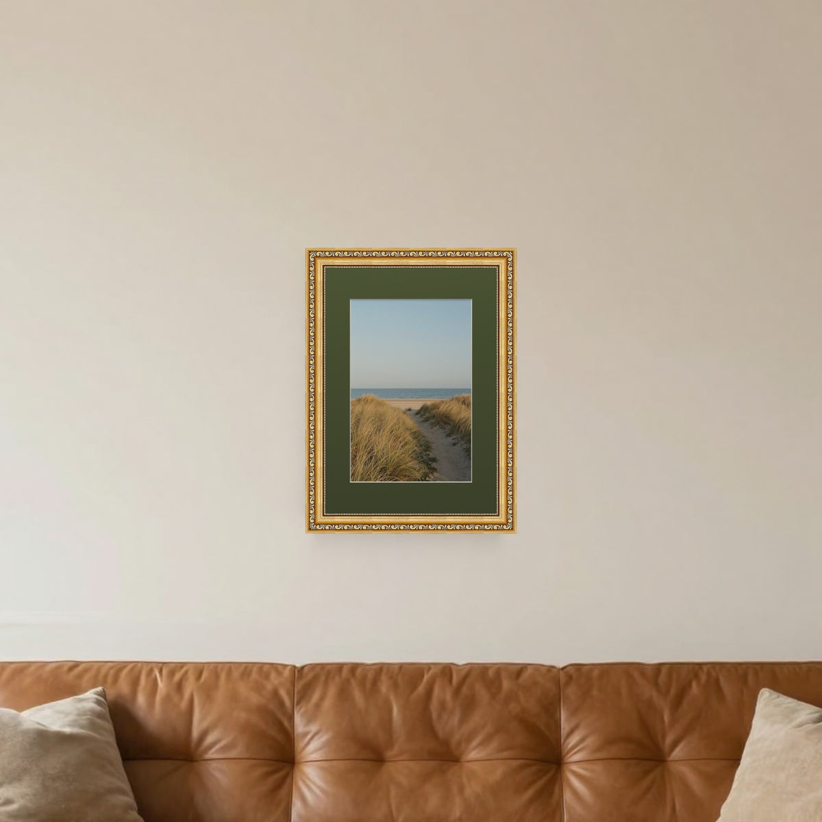 Louis Gold picture frame with a green mount hanging on a living room wall