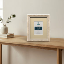 Louis Silver picture frame with an ivory mount standing on a table