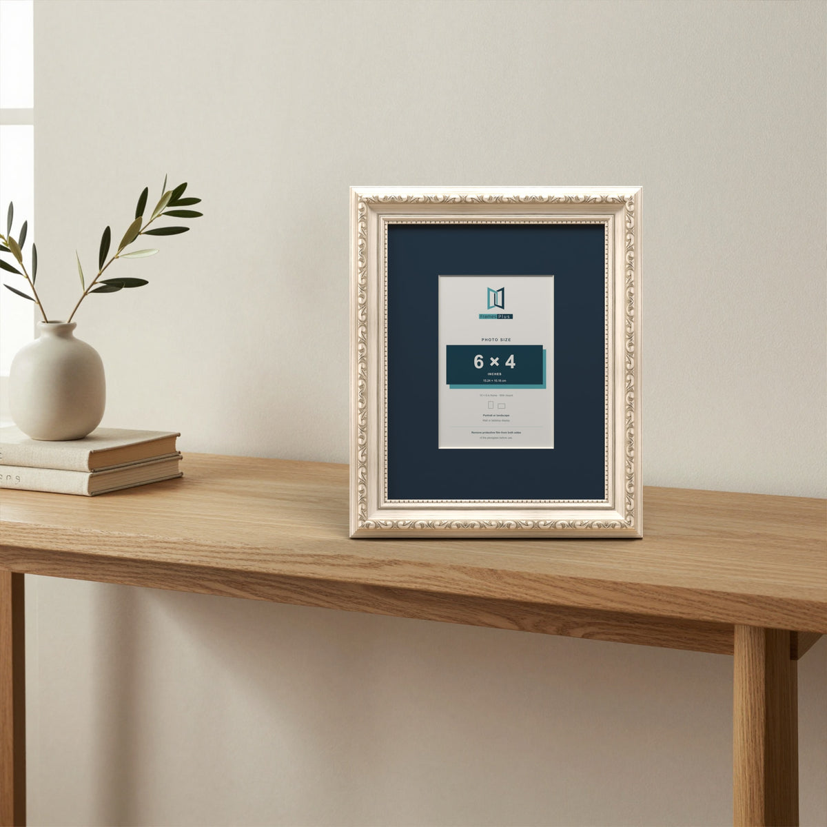 Louis Silver picture frame with a Pacific Blue mount standing on a table
