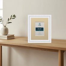 Louis White picture frame with an ivory mount standing on a table