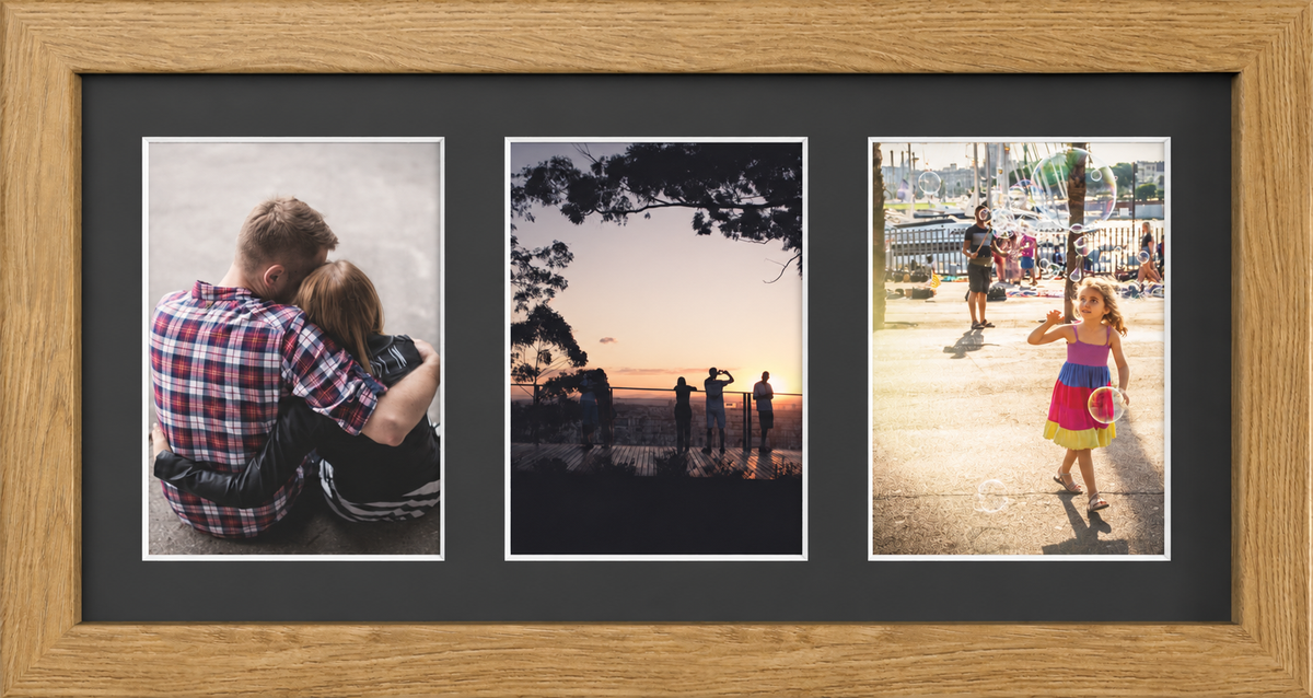 Oak Multi-Aperture Frame for 3 Photos 7x5" with Black Mount displaying photographs