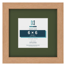 Oak 10 x 10 inch picture frame with a green mount for a 6 x 6 inch photo
