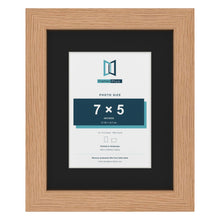 Oak 10 x 8 inch picture frame with a black mount for a 7 x 5 inch photo