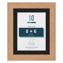 Oak 10 x 8 inch picture frame with a black mount for an 8 x 6 inch photo