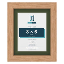 Oak 10 x 8 inch picture frame with a green mount for an 8 x 6 inch photo
