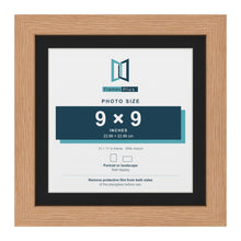 Oak 11 x 11 inch picture frame with a black mount for a 9 x 9 inch photo