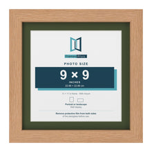 Oak 11 x 11 inch picture frame with a green mount for a 9 x 9 inch photo