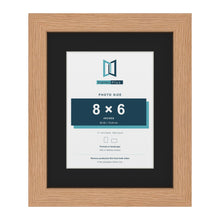 Oak 11 x 9 inch picture frame with a black mount for an 8 x 6 inch photo