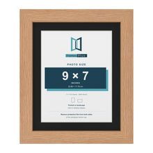 Oak 11 x 9 inch picture frame with a black mount for a 9 x 7 inch photo