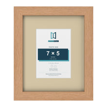 Oak 11 x 9 inch picture frame with an ivory mount for a 7 x 5 inch photo
