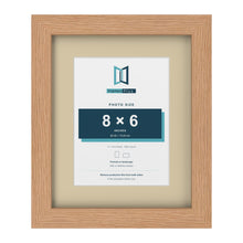 Oak 11 x 9 inch picture frame with an ivory mount for an 8 x 6 inch photo