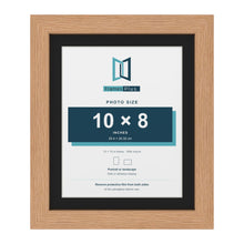 Oak 12 x 10 inch picture frame with a black mount for a 10 x 8 inch photo