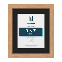 Oak 12 x 10 inch picture frame with a black mount for a 9 x 7 inch photo