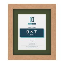 Oak 12 x 10 inch picture frame with a green mount for a 9 x 7 inch photo