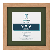 Oak 12 x 12 inch picture frame with a green mount for a 9 x 9 inch photo
