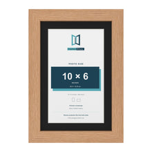 Oak 12 x 8 inch picture frame with a black mount for a 10 x 6 inch photo