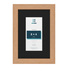 Oak 12 x 8 inch picture frame with a black mount for an 8 x 4 inch photo