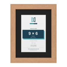 Oak 12 x 9 inch picture frame with a black mount for a 9 x 6 inch photo