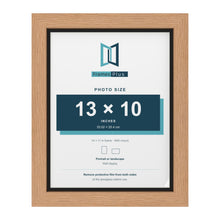 Oak 14 x 11 inch picture frame with a black mount for a 13 x 10 inch photo