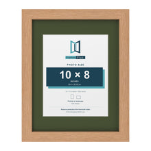 Oak 14 x 11 inch picture frame with a green mount for a 10 x 8 inch photo