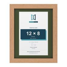 Oak 14 x 11 inch picture frame with a green mount for a 12 x 8 inch photo