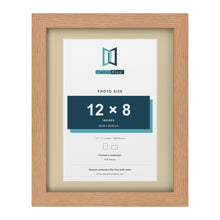 Oak 14 x 11 inch picture frame with an ivory mount for a 12 x 8 inch photo