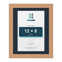 Oak 14 x 11 inch picture frame with a Pacific Blue mount for a 12 x 8 inch photo