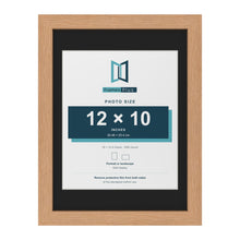 Oak 16 x 12 inch picture frame with a black mount for a 12 x 10 inch photo