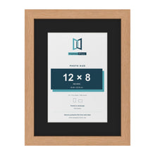 Oak 16 x 12 inch picture frame with a black mount for a 12 x 8 inch photo
