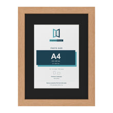 Oak 16 x 12 inch picture frame with a black mount for an A4 photo