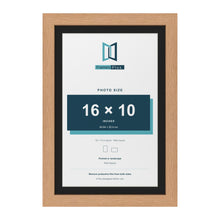 Oak 18 x 12 inch picture frame with a black mount for a 16 x 10 inch photo