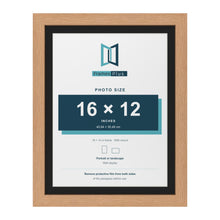 Oak 18 x 14 inch picture frame with a black mount for a 16 x 12 inch photo
