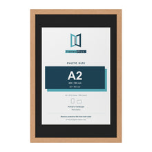 Oak 30 x 20 inch picture frame with a black mount for an A2 photo
