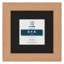 Oak 7 x 7 inch picture frame with a black mount for a 4 x 4 inch photo