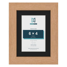 Oak 8 x 6 inch picture frame with a black mount for a 6 x 4 inch photo