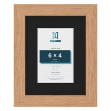Oak 9 x 7 inch picture frame with a black mount for a 6 x 4 inch photo